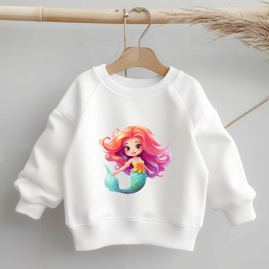 Bügelbild Meerjungfrau mit schimmernder Flosse auf weißem Kinder-T-Shirt.