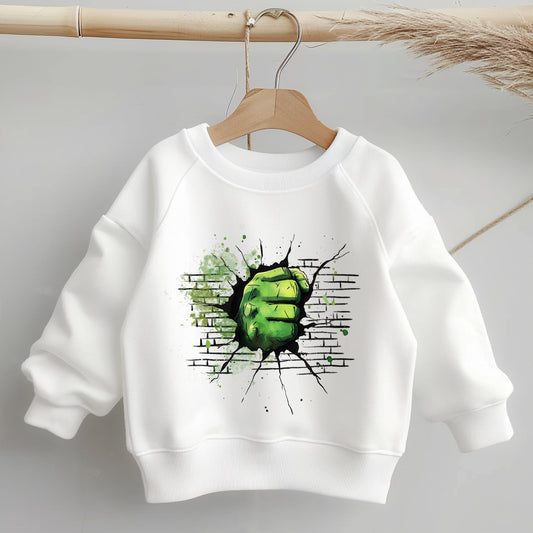 Weißer Kinderpullover mit grünem Superkraft-Bügelbild: