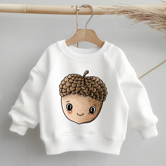 „Kinder-Sweater mit mittig platziertem Bügelbild einer lächelnden Eichel („Eichelchen“); zeigt Größe und Position des Motivs auf dem Kleidungsstück.“