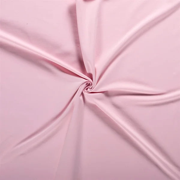 Nahaufnahme des French Terry Uni Stoffes in zartem Soft Pink, weich und angenehm auf der Innenseite.