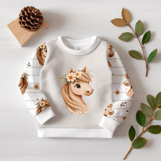 Hochwertiges Stoffpanel mit zartem Pferde-Design, perfekt für Baby- und Kinderkleidung.