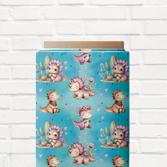 Jersey-Stoff „Süße Dinos“ mit verspieltem Dino-Design, ideal für Baby- & Kinderkleidung.