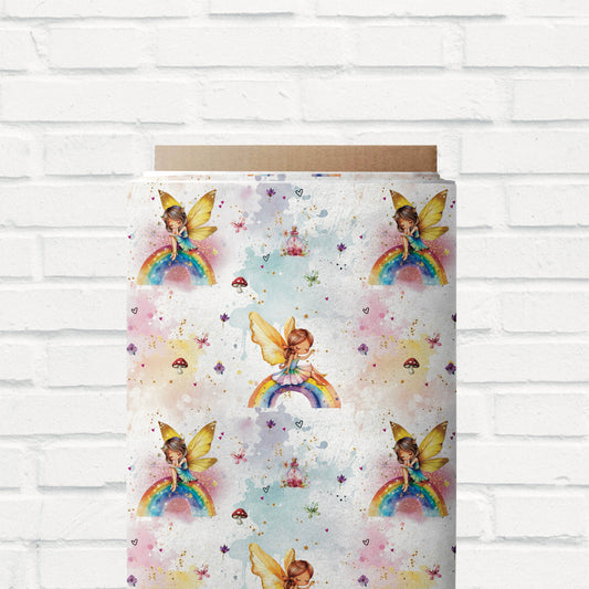 Märchenhafter Jersey & French Terry Stoff mit Feen, goldenen Flügeln und magischen Regenbogenfarben.