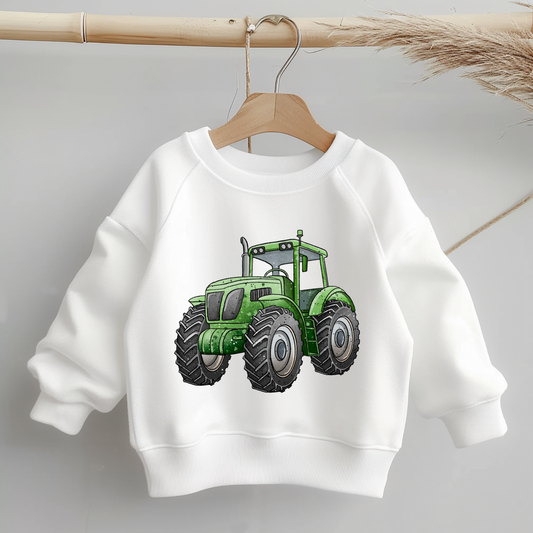 Bügelbild „Trecker“ – alternative Ansicht/Varianten: Traktor in Grün sowie Version mit Anhänger & Heuballen; gleiche Illustration, passend zum Stoffdesign „Trecker-Crew“.