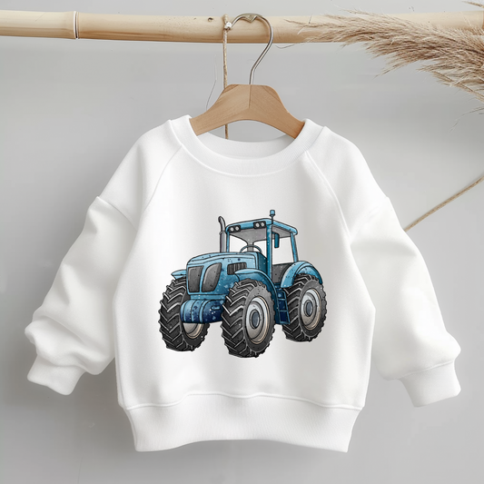 Bügelbild „Trecker“ – alternative Ansicht/Varianten: Traktor in Grün sowie Version mit Anhänger & Heuballen; gleiche Illustration, passend zum Stoffdesign „Trecker-Crew“.