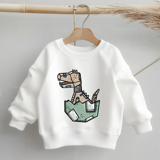 „Mockup eines Kinder-Sweaters: mittig auf der Brust das Bügelbild eines schlüpfenden Robo-Dinos in grüner Eierschale; zeigt Größe und Platzierung des Motivs.“
