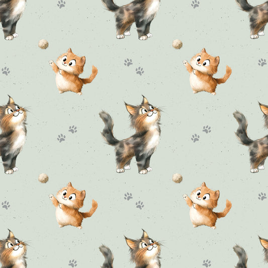 Stoff mit verspieltem Kätzchen-Design auf hellgrünem Hintergrund.
