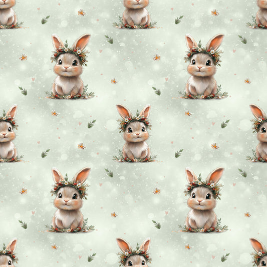Hochwertiger Kinderstoff mit verspieltem Hasen-Design auf sanftem Grün für süße Nähprojekte.