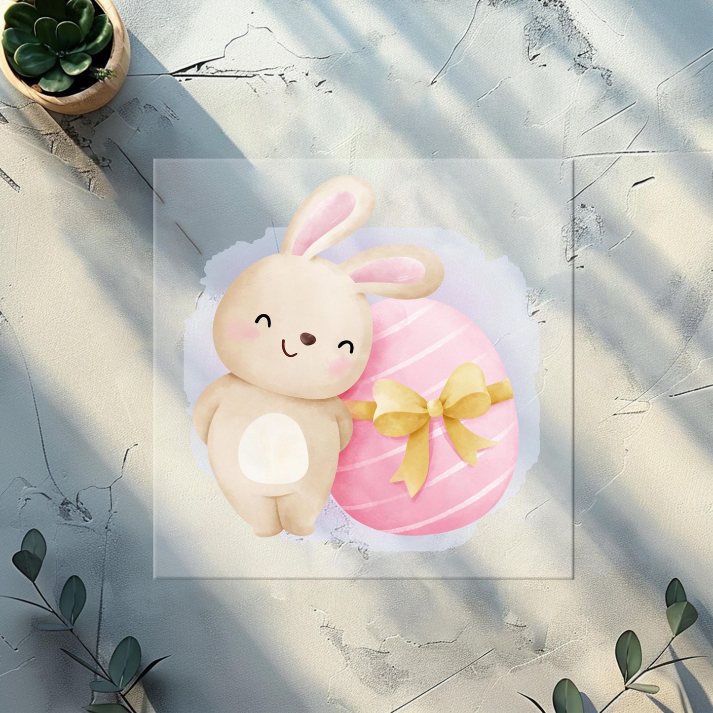 Detailansicht: Bügelbild "Hase mit Schleifenosterei" auf Jersey-Stoff für Kinderkleidung.