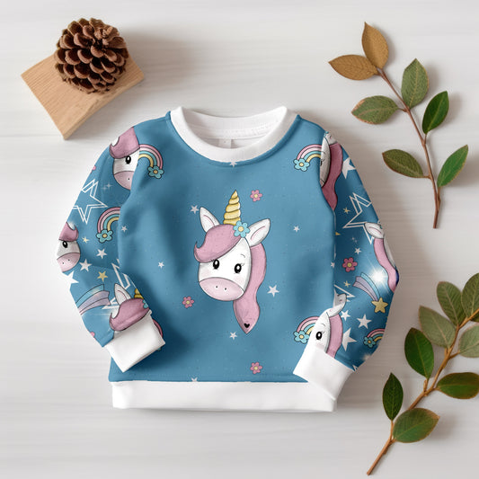 Hochwertiger Jersey oder French Terry mit verspieltem Einhorn-Motiv und abgestimmtem Musterstoff.