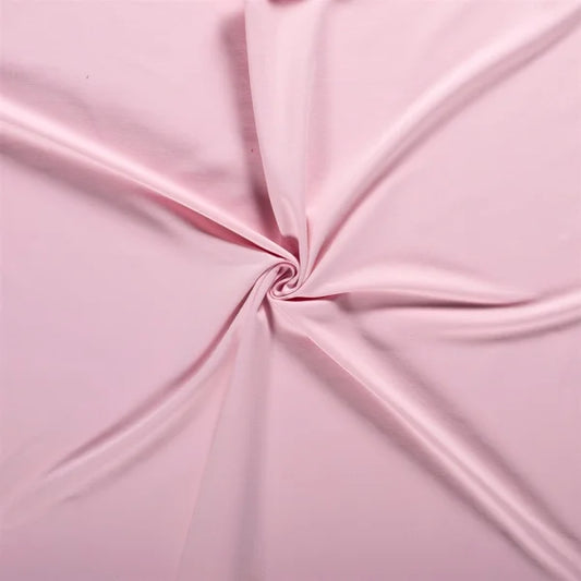 Nahaufnahme des French Terry Uni Stoffes in zartem Soft Pink, weich und angenehm auf der Innenseite.