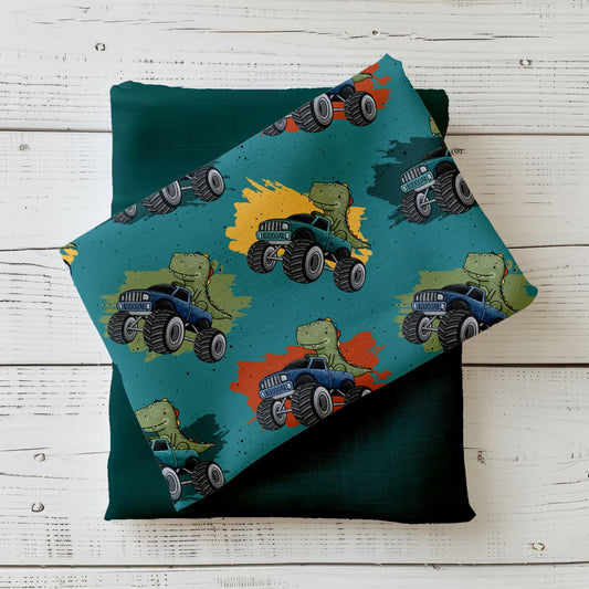 Handgemalter Kinderstoff „Dino Truck“ – Dinos im Monstertruck mit Farbsplashes auf petrol/türkis, kombiniert mit dunkelpetrol Uni (Jersey/French Terry), Katzengold-Designs