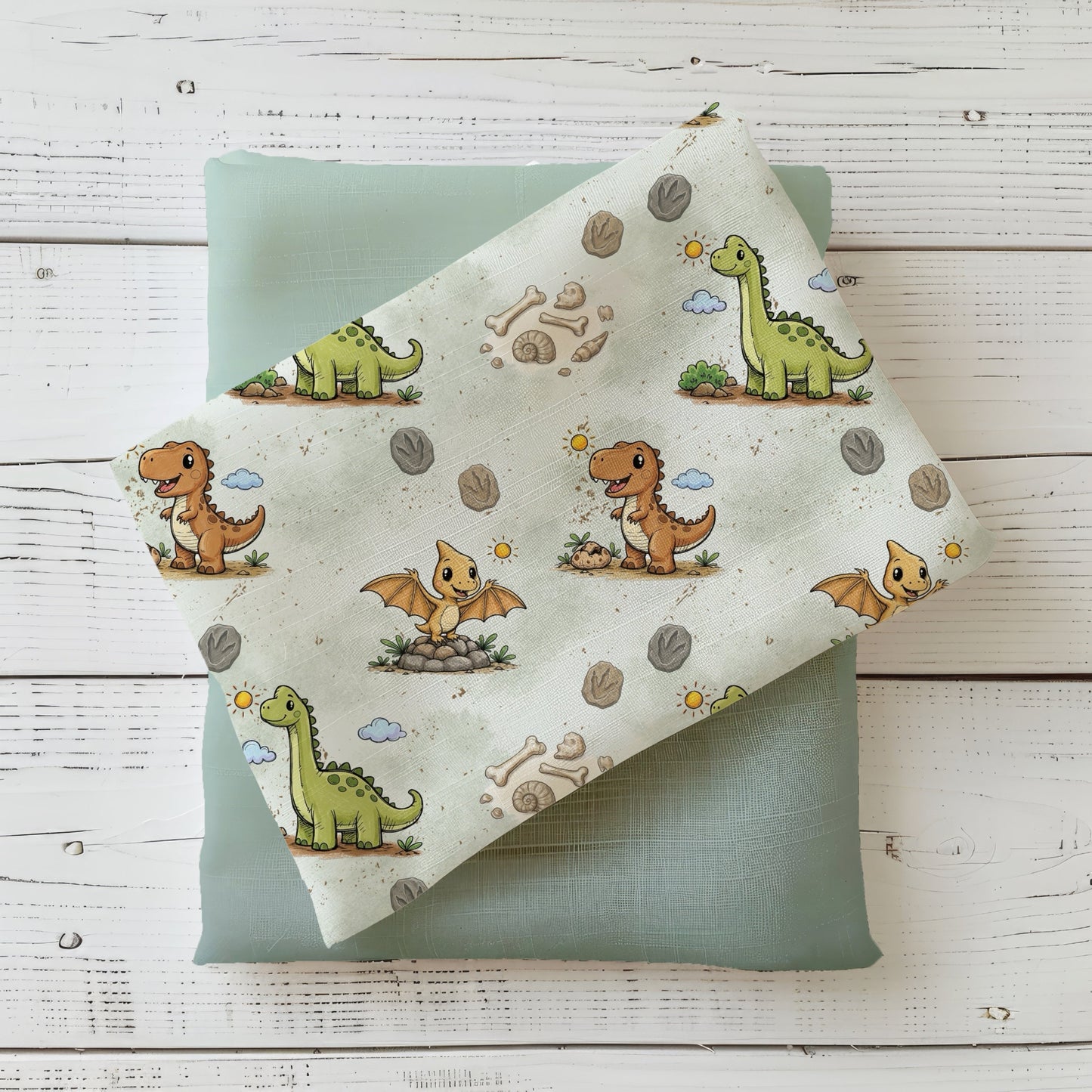 Dino Stoff für Kinderkleidung mit liebevollen Dinosaurier-Motiven in Mint