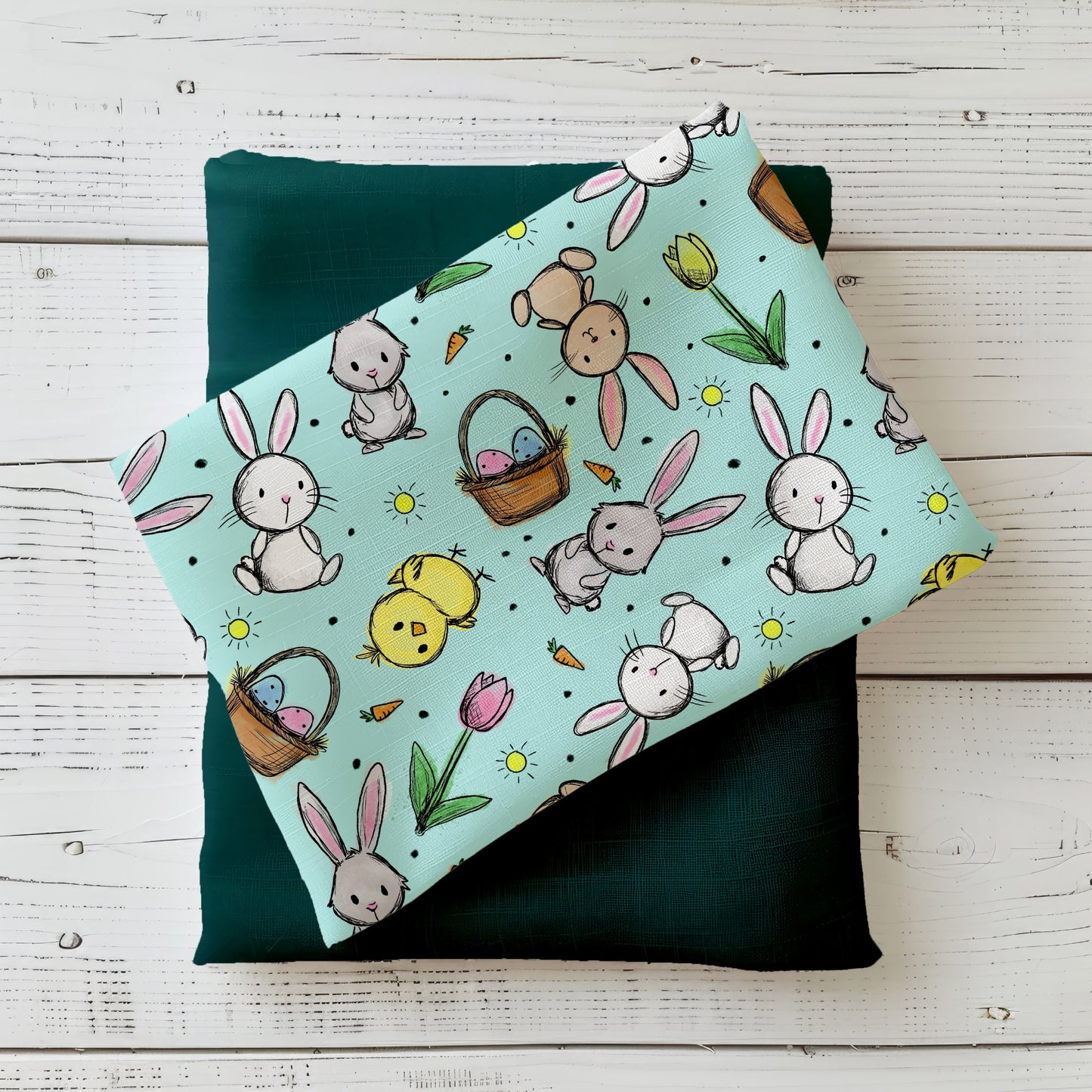 Hasenglück Mint Stoffdesign mit Hasen, Küken, Ostereiern, Karotten und Tulpen auf mintfarbenem Hintergrund