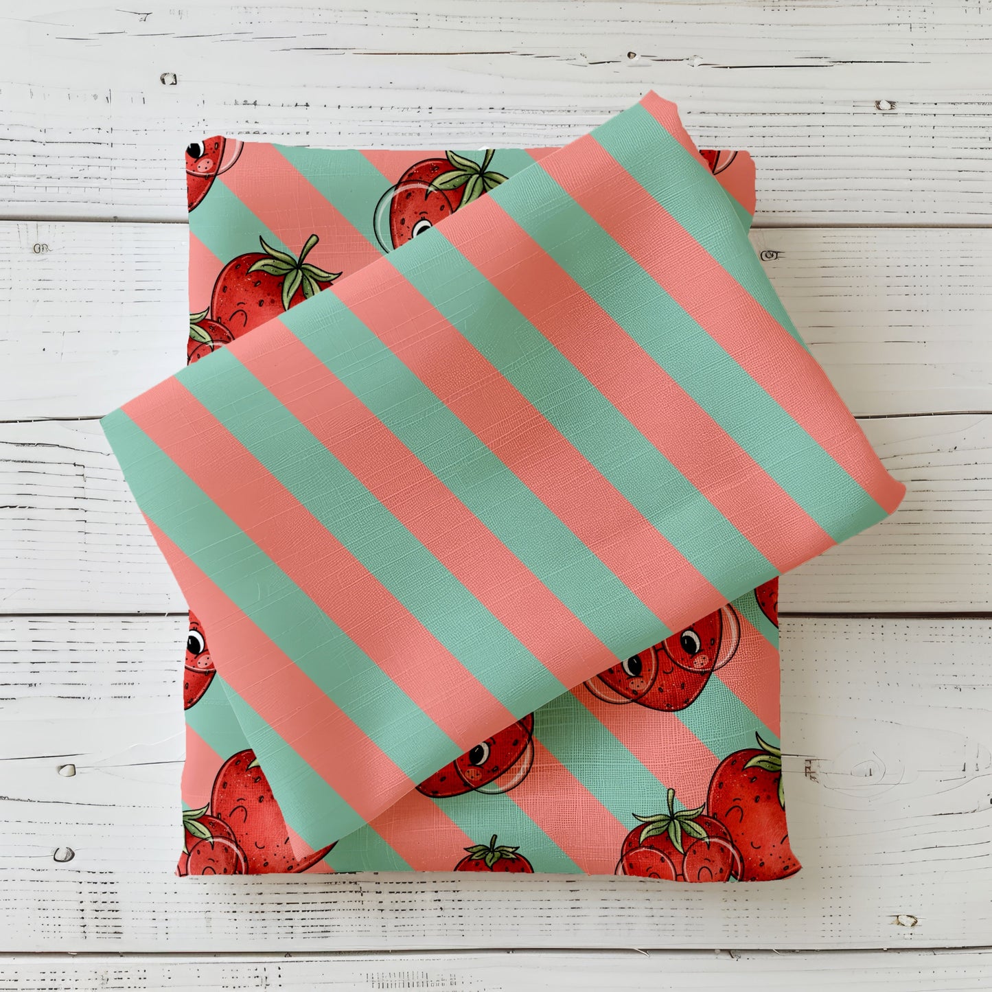 Mint-Apricot Streifenstoff kombiniert mit Erdbeer-Design Stoff, sommerlicher Kombistoff auf weißem Holz fotografiert