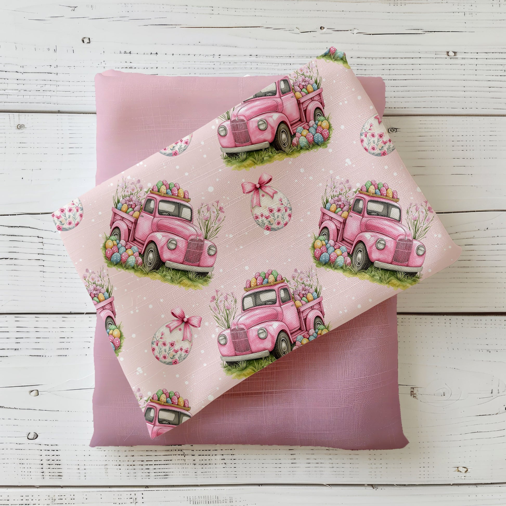 Osterfahrt Rosé Stoffdesign mit rosa Oster-Truck, bunten Ostereiern und Blumen auf rosafarbenem Hintergrund
