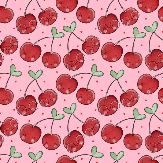 Cherrys Stoffdesign mit roten Kirschen, grünen Herzblättern und kleinen roten Herzen auf rosa Hintergrund