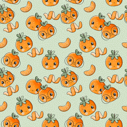 Allover-Stoff mit lachenden Mandarinen auf salbeigrünem Hintergrund mit weißen Pünktchen.